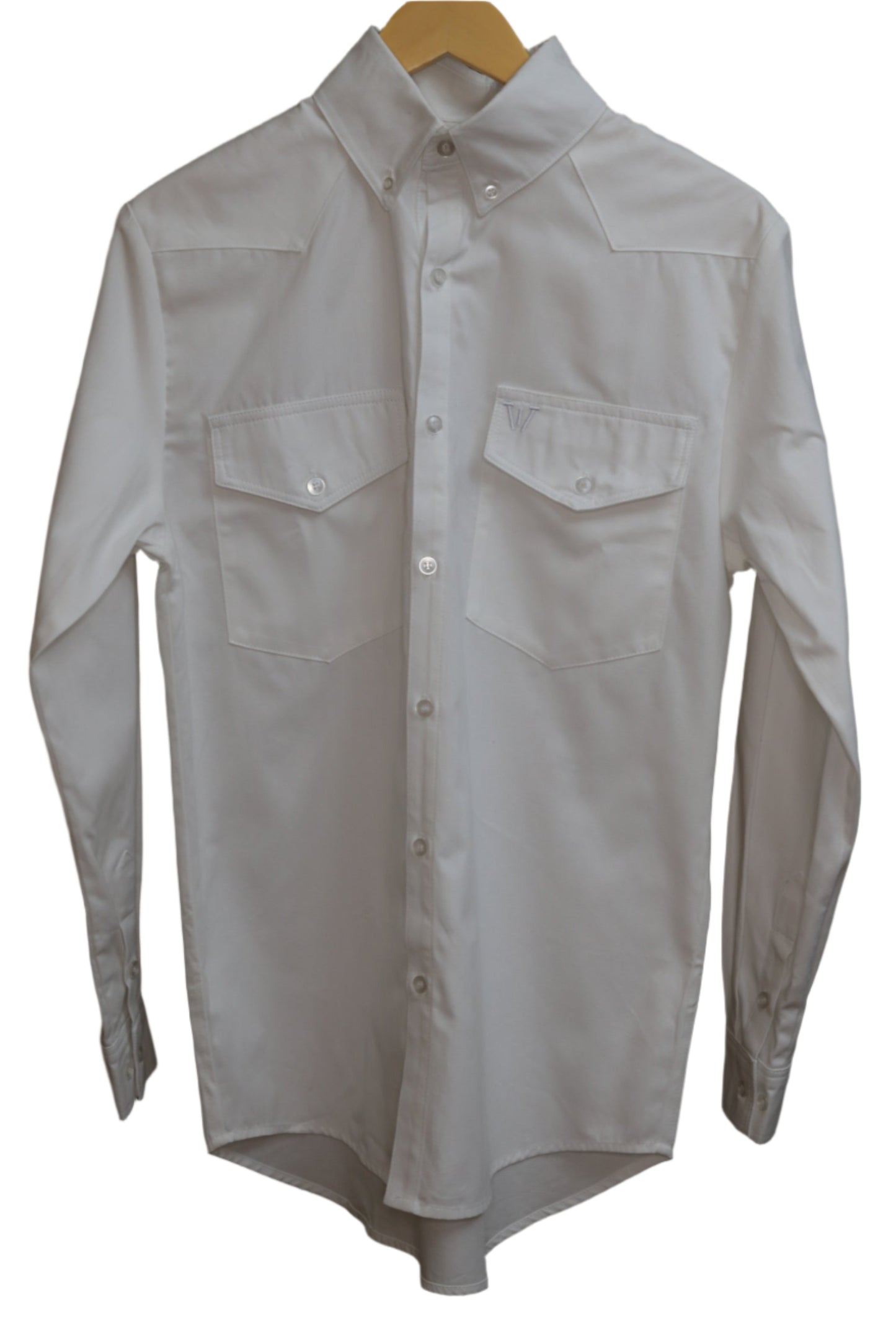 White shirt on a hanger against a brown background