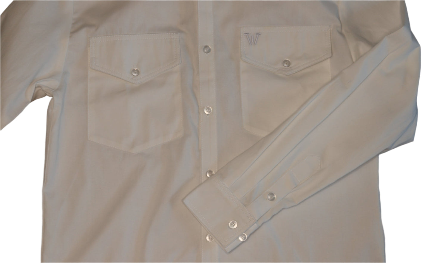 white shirt with button details against a white background