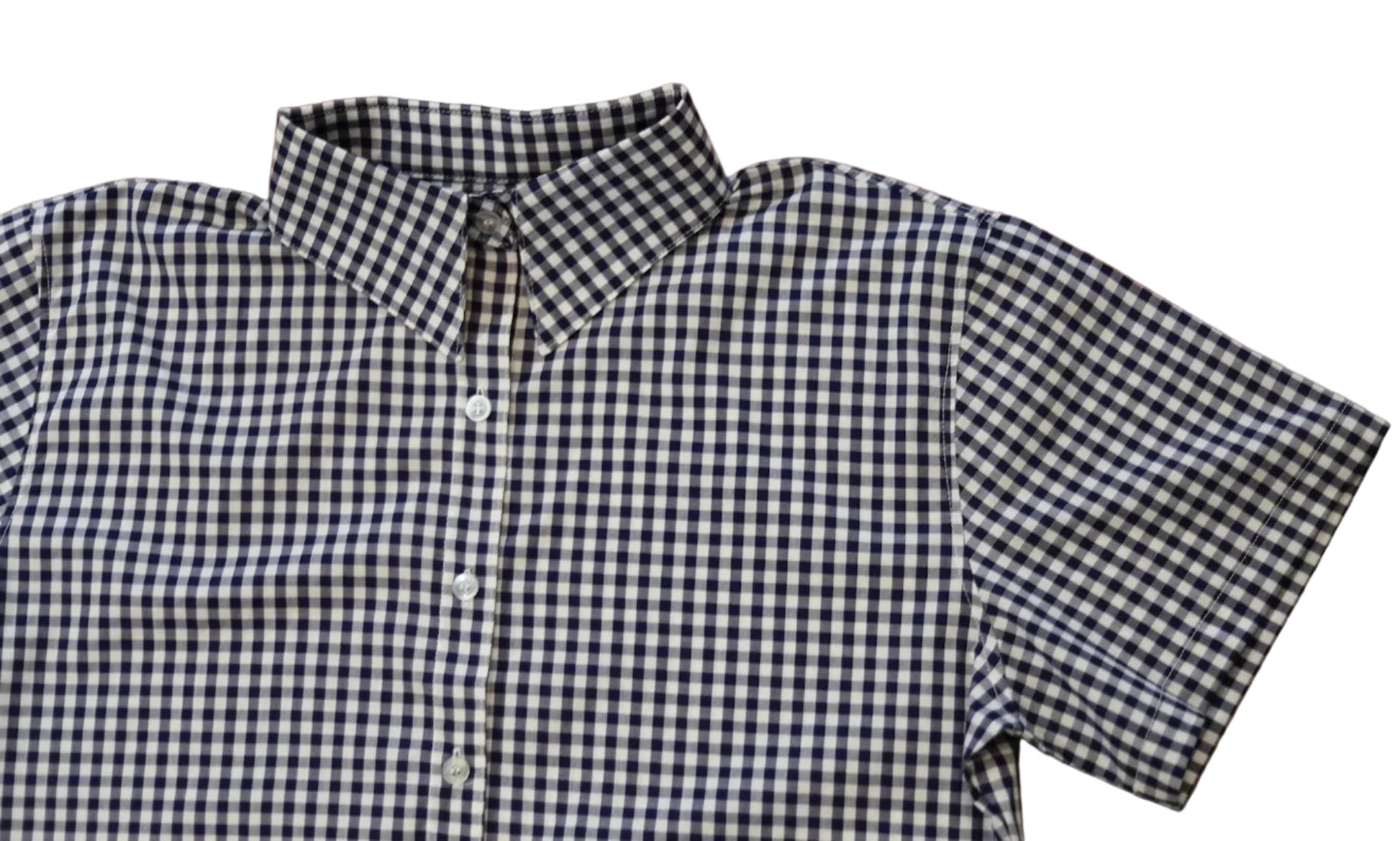 short sleeve close up of sleeve of women's navy blue gingham top