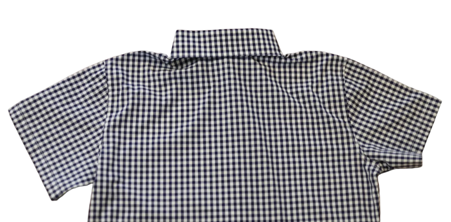 short sleeve close up of sleeve of women's navy blue gingham top
