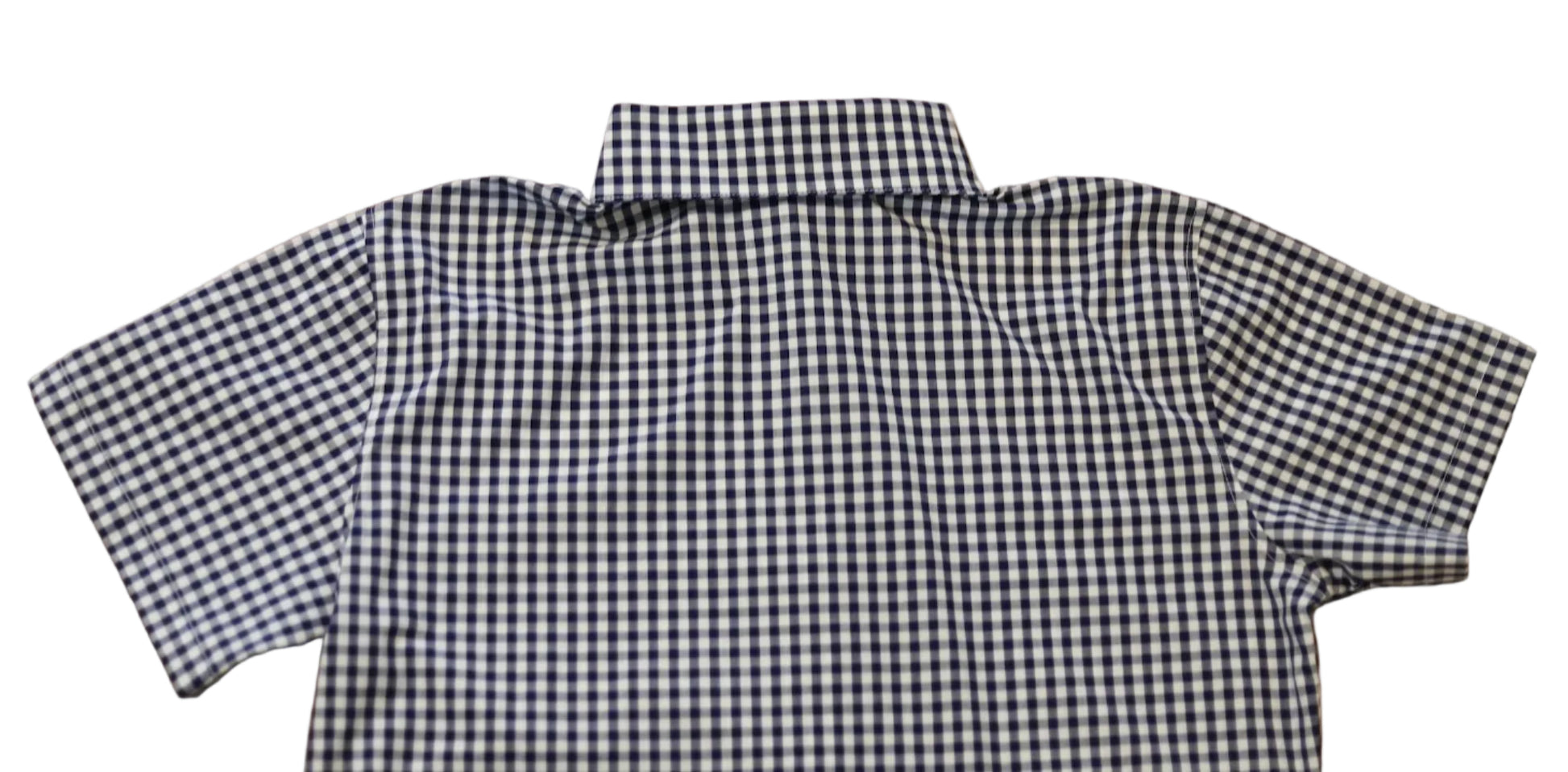 short sleeve close up of sleeve of women's navy blue gingham top