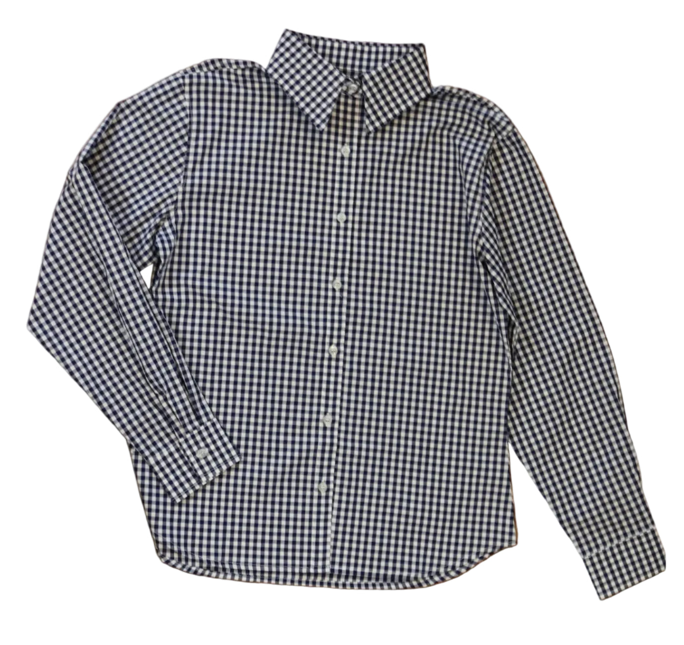 woman in cowgirl hat wearing gingham navy blue long sleeve shirt button down