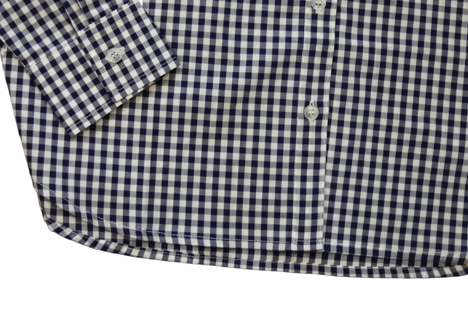 woman in cowgirl hat wearing gingham navy blue long sleeve shirt button down bottom of shirt