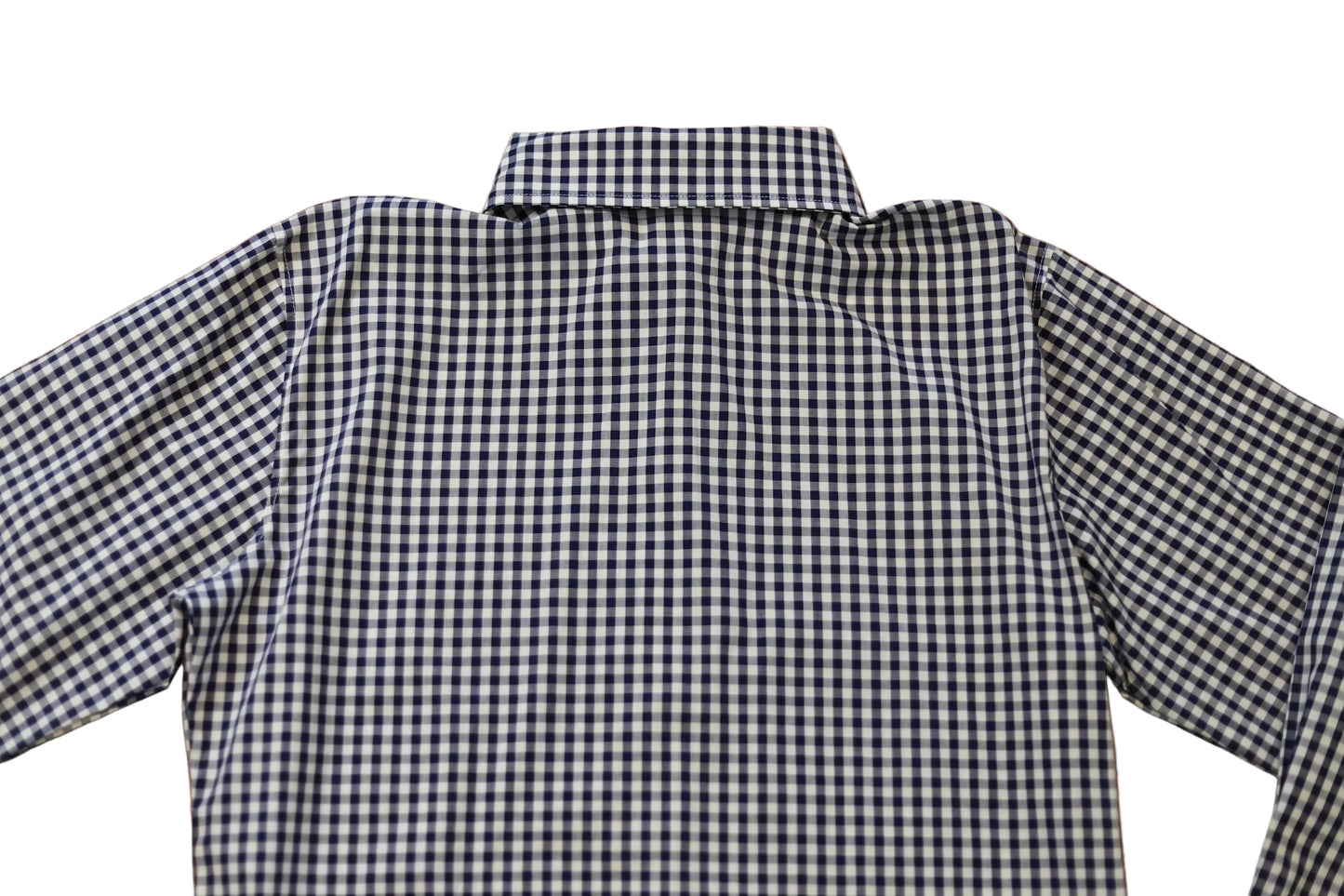 woman in cowgirl hat wearing gingham navy blue long sleeve shirt button down