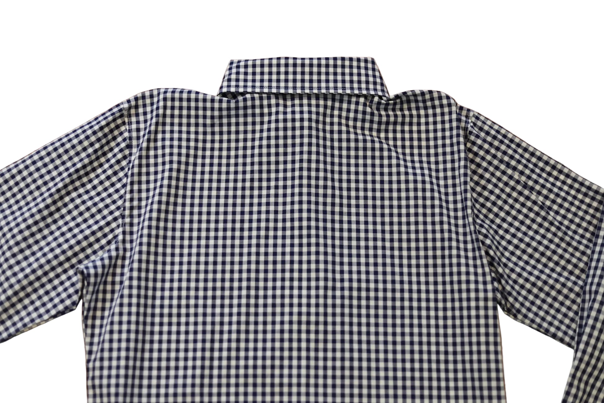 woman in cowgirl hat wearing gingham navy blue long sleeve shirt button down